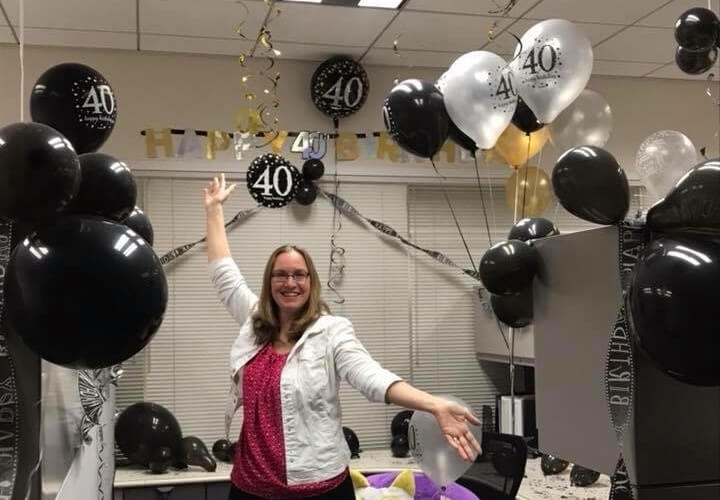 2020 OfficeNinjas All-Star Laura Feigel poses for a photo during her surprise birthday celebration at work.